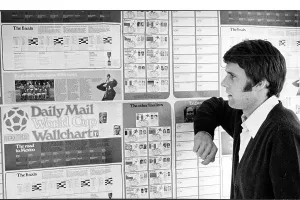Geoff Hurst studies the Daily Mail World Cup Wall Chart 1970