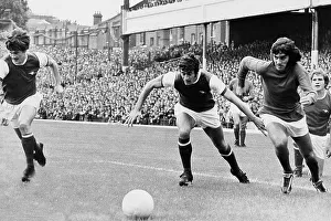 George Best leaves Arsenal's Eddie Kelly and Frank McClintock in his wake. Pat Rice is seen at the far left of the picture