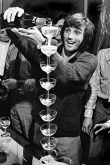 Images Dated 7th September 2023: George Best pouring champagne