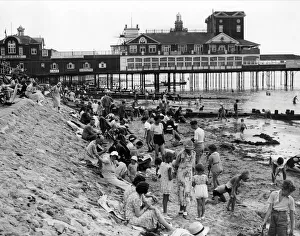 Thirties Prints: Holidaymakers on the beach by Bognor Regis pier 1935
