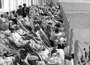 England Prints: Holidaymakers in deckchairs at Bognor, West Sussex 1960