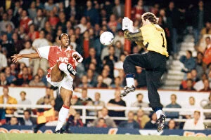 Images Dated 19th October 2023: Ian Wright scores past keeper Dmitri Kharine. 1996