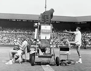 1970s Prints: Ilie Nastase, argues with the umpire while Bjorn Borg quietly sits it out