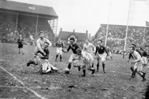 Irish forwards rush the ball back from their line to relieve the English pressure in the Rugby International in Dublin