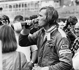 Motor Racing Collection: James Hunt swigging champagne