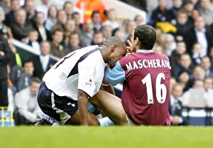 Javier Mascherano of West Ham reacts after after he was bitten by Spurs Jermain Defoe