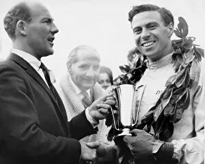 Motor Racing Collection: Jim Clark accepts the trophy from Sir Stirling Moss 1962