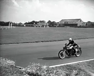 Photograph Prints: John Surtees seen motorcycle racing at Aintree