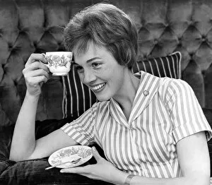 Famous Faces Collection: Julie Andrews with a cup of tea, 1960