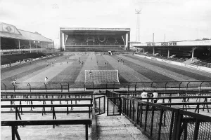 A lone policeman and his dog patrol the empty terraces at Villa Park where Aston Villa were forced by Uefa to play their European Cup tie behind closed doors