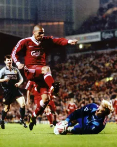 Players Prints: Man Utd's keeper Peter Schmeichel dives to save from Stan Collymore