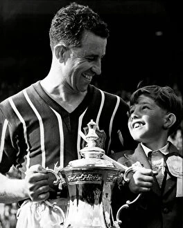 Manchester City FC Collection: Manchester City Footballer Roy Paul after FA cup final with his son Robert 1956