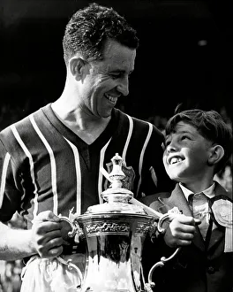 Manchester City FC Prints: Manchester City Footballer Roy Paul after FA cup final with his son Robert 1956