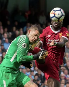 Liverpool V Man City Prints: Manchester City goalkeeper Ederson clashes with Liverpool's Sadio Mane