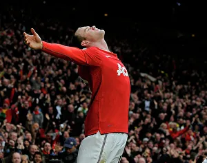 Archive Prints: Manchester United footballer Wayne Rooney celebrates after scoring a goal against Manchester City