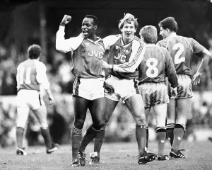 Pictures Prints: Michael Thomas (left) and Paul Merson celebrate Arsenal's first goal against United