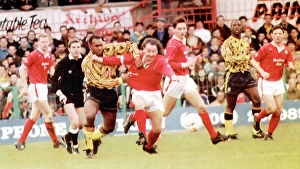 Images Dated 22nd September 2023: Mickey Thomas (red shirt) passes David Rowcastle of Arsenal for FA Cup 3rd round match; Wrexham v
