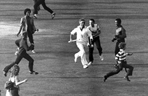 Images Dated 17th January 2024: Mike Brearley runs off the pitch holding the cricket stumps