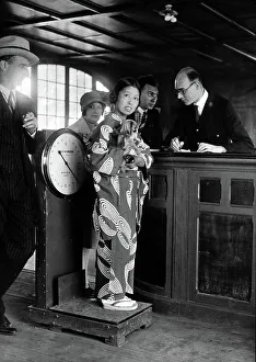 Times Gone By Prints: Miki, the Japanese artiste, standing with her dog on the scales at Le Bourget Airport