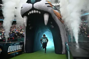 Mitch Morse runs out at the start of the game Jacksonville Jaguars v New England Patriots. Wembley stadium, London 2024