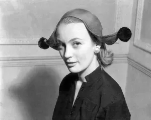 Hats Prints: Model wearing jester style hat 1955