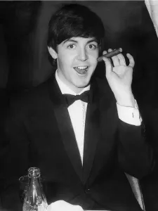 Paul McCartney smokes a havana cigar at The Empire, Leicester Sq