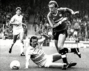 Man City V Man Utd Prints: Peter Barnes of Manchester United (Ex City) beats John Gidman of City (Ex United)