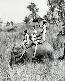 Images Dated 15th July 2022: Queen Elizabeth II riding on an elephant in Nepal 1961