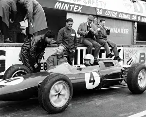 Archive Prints: Racing driver Trevor Taylor in the Lotus Climax. Centre standing is Jim Clark 1963
