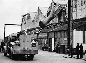 Aircraft Prints: An RAF Avro Anson aircraft crashes into a hangar at Croydon Aerodrome 1949