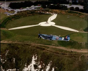 Aircraft Prints: RAF Spitfire flies over the Battle of Britain Museum and Memorial at Capel-Le-Ferne in Dover