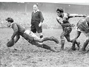 Rugby Union Collection: Rex Willis the Welsh scrum half, dives in getting the ball back to his partner Cliff Morgan