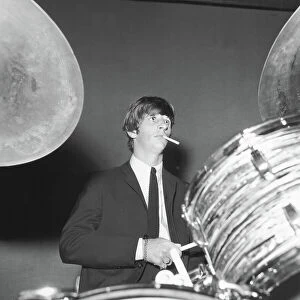 The Beatles Collection: Ringo Starr smokes a cigarette at the drums as the Beatles perfo