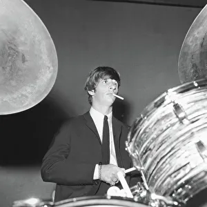 Sixties Prints: Ringo Starr smokes a cigarette at the drums as the Beatles perfo