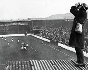 Britain at War Collection: Roof spotter at football match
