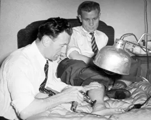 Newcastle United Prints: Sam Cowan massages Newcastle player Charlie Crowes injured foot