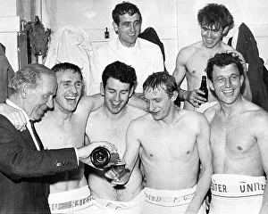 Pictures Prints: United's manager Matt Busby pours champagne for Denis Law as Pat Crerand