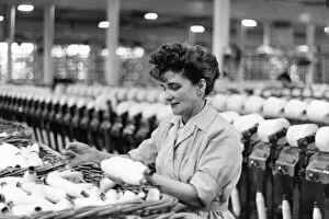 Images Dated 8th April 2021: Woman in a Cotton Mill