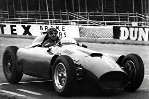 Motor Racing Collection: World champion Juan Fangio driving a Ferrari during practice at Silverstone,