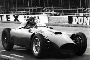 Mail Newspapers Prints: World champion Juan Fangio driving a Ferrari during practice at Silverstone