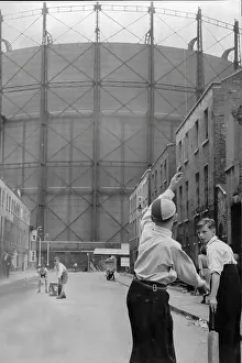 Cricket Prints: Young boys playing cricket in a street near the Oval cricket ground